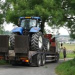 tractor on back of a truck