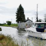 Boat travelling through an open bridge